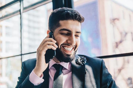 man-beard-smiling-smart-phone