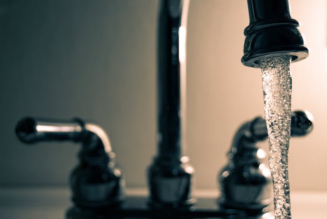 a-tap-running-with-water